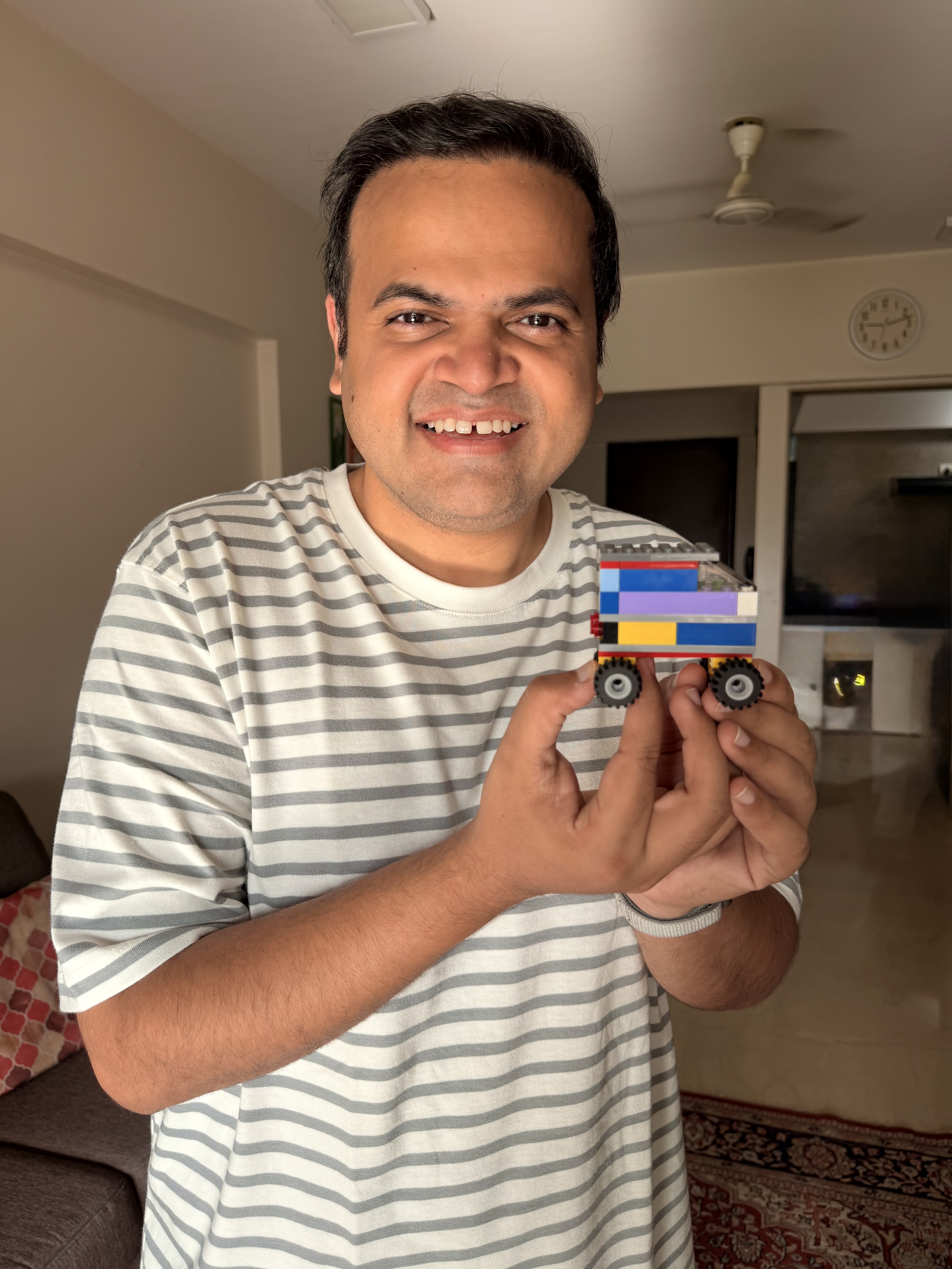 Abhinav holding his LEGO car build